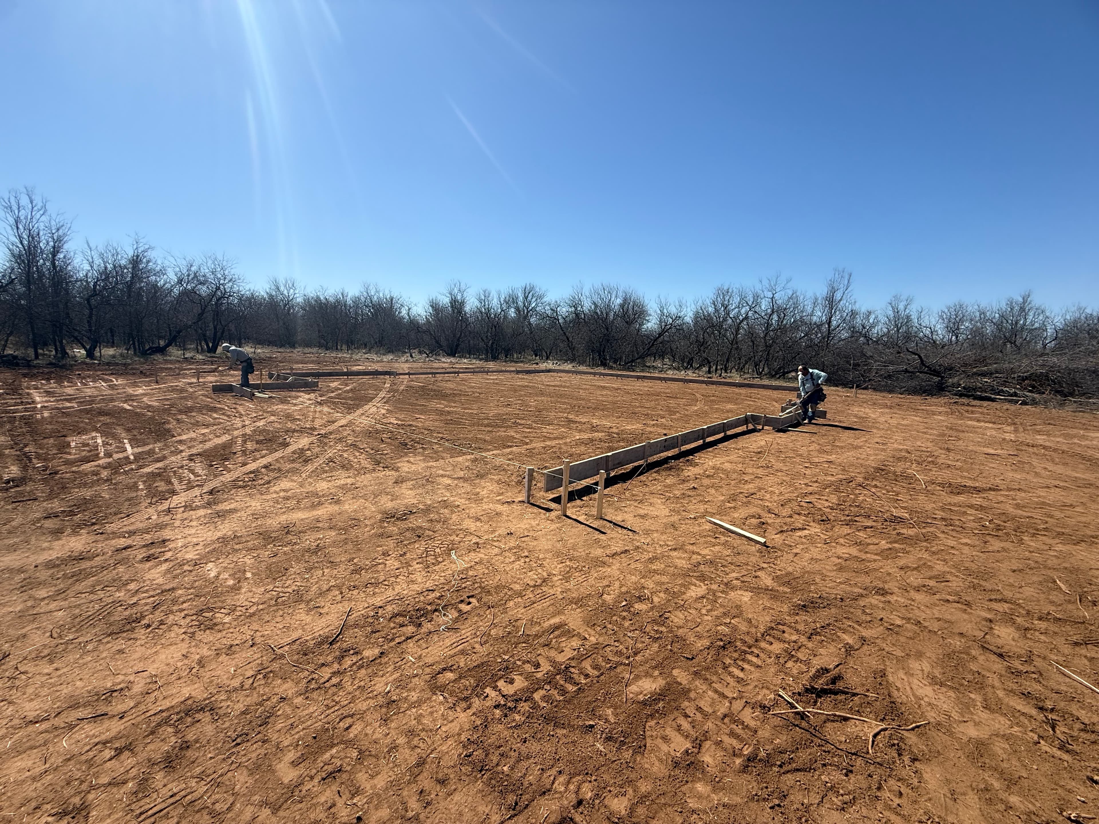Crew setting forms for a concrete foundation in North Texas