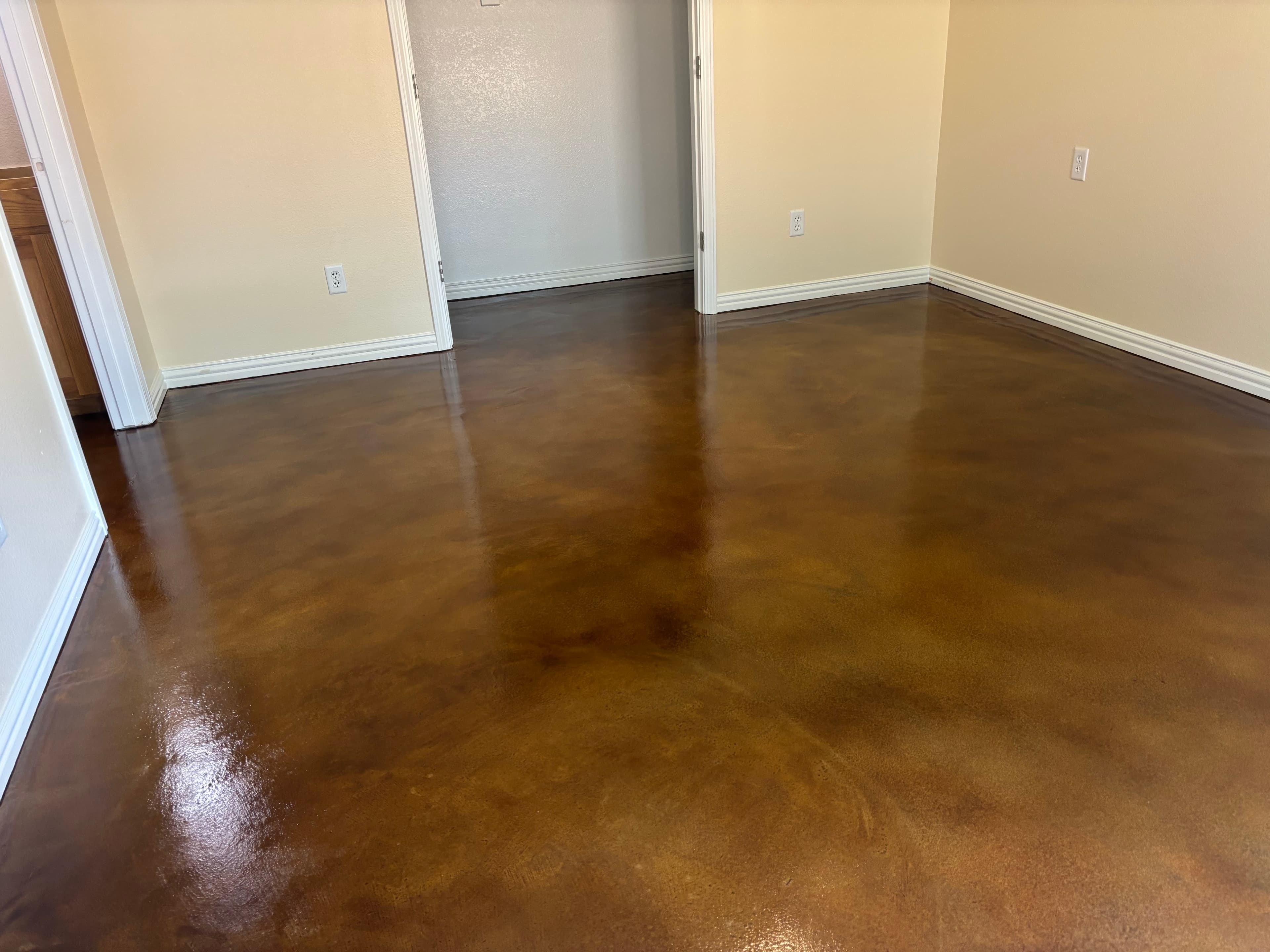 Finished acid stained interior concrete floor with high gloss sealer
