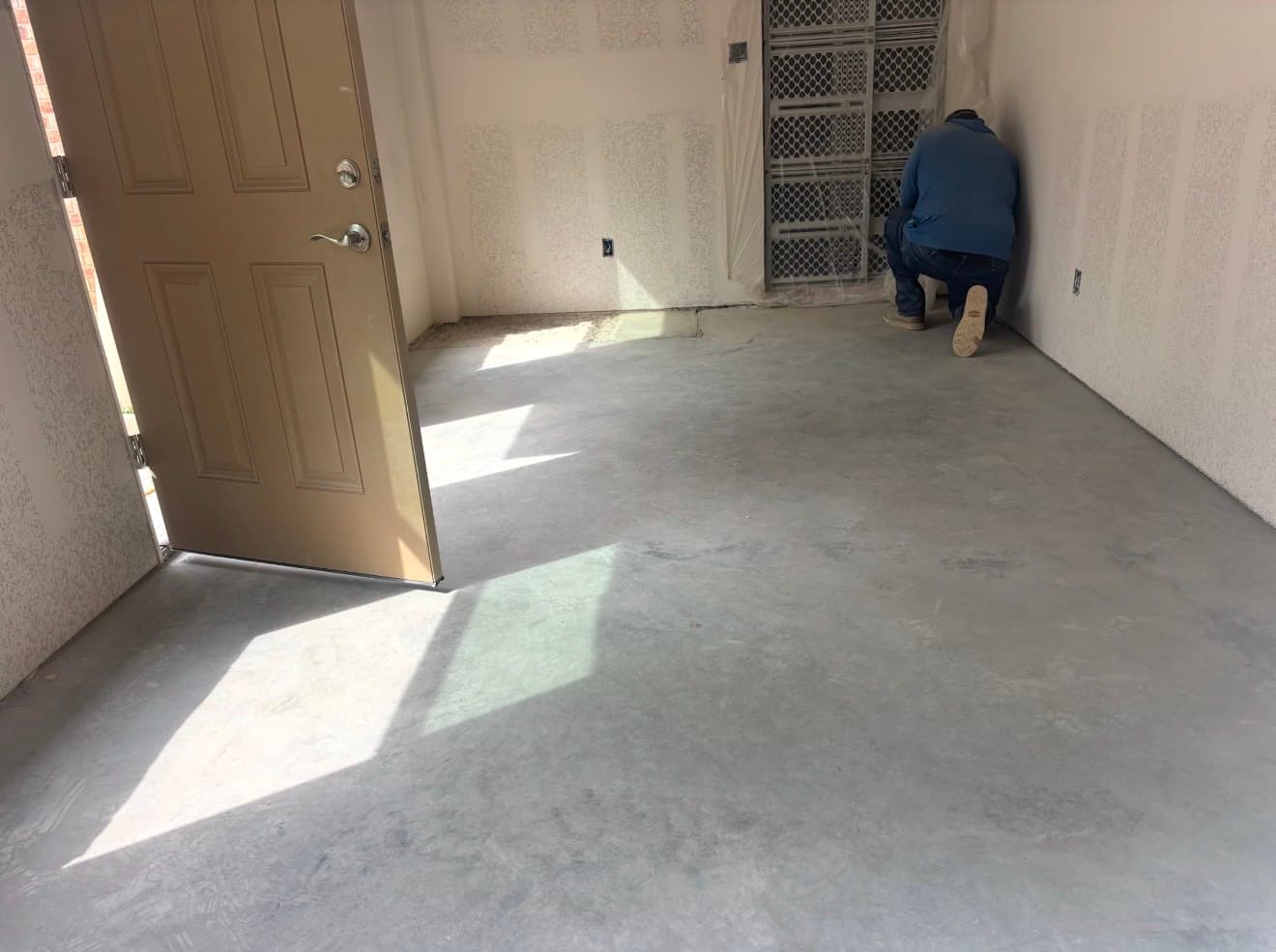 Interior concrete floor prepped for resurfacing overlay