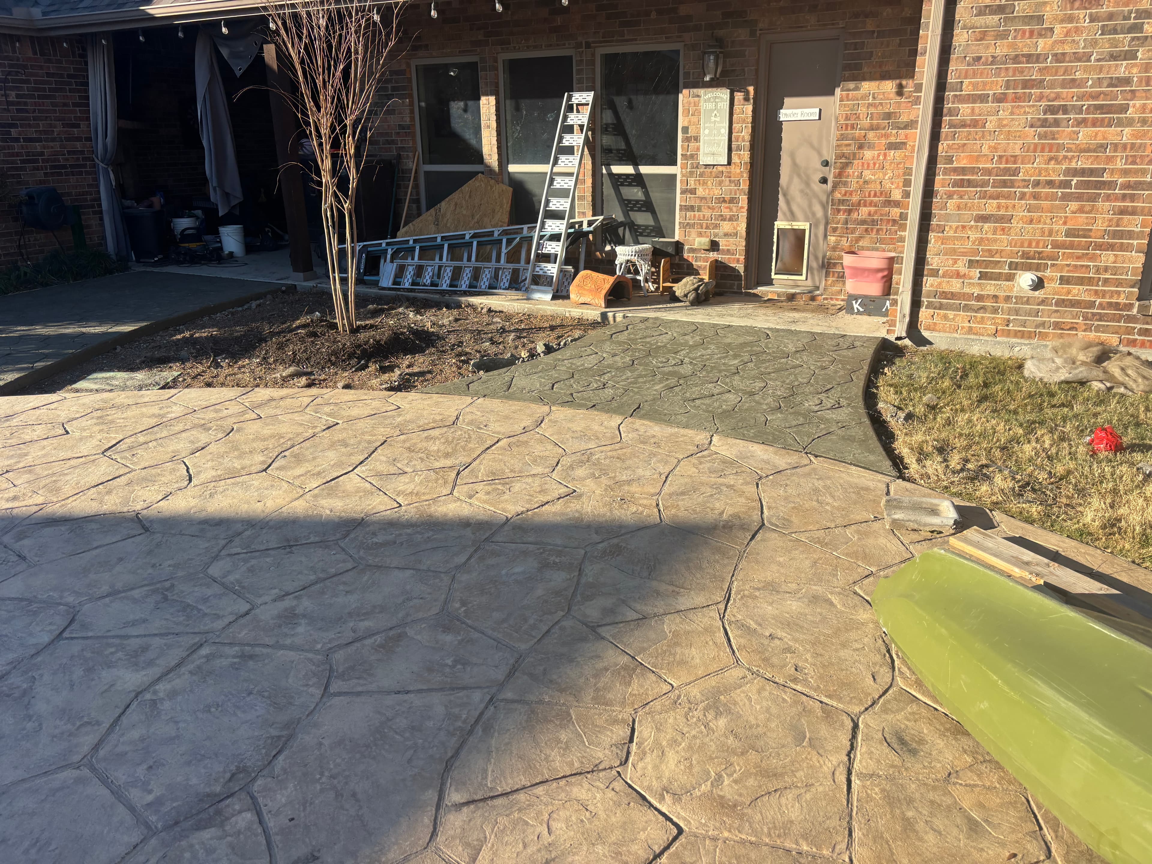 Stamped concrete patio with flagstone pattern in North Texas